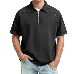 Detailed view of men's polo shirt featuring a zip collar and heavy textured fabric