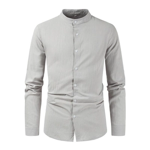Detail of light grey cotton linen shirt showing breathable fabric and button closure
