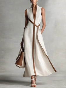 Elegant sleeveless cotton linen dress in beige with contrasting brown trim and waist belt