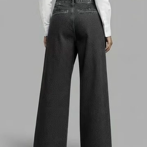 High-waisted black wide-leg denim jeans with back pocket and minimalist loose fit silhouette