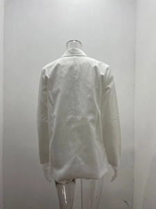Rear view of white long-sleeved blazer showing tailored shoulder and waistline details
