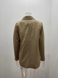 Back view detail of brown mid-length blazer featuring straight cut and center seam