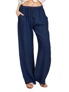 Detail of dark blue linen wide-leg pants featuring elastic waistband and drawstring