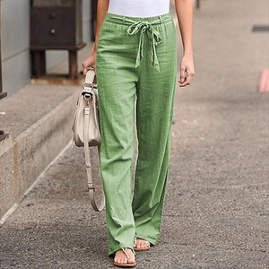 Detail of green cotton linen wide leg trousers showing elastic drawstring waistband