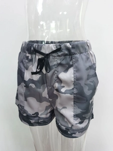 Detail view of high-waist grey camouflage shorts with elastic band and black drawstring
