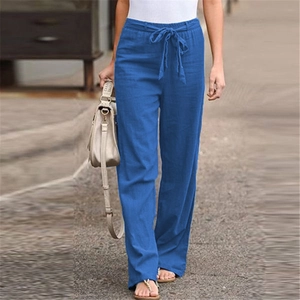 Detail of royal blue linen wide-leg pants featuring elastic drawstring waist for summer comfort