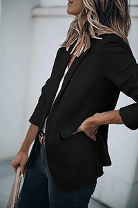 Detail of classic black blazer with notched lapels and flap pockets for office wear