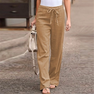 Outdoor street style shot of khaki wide-leg linen pants with elastic drawstring waist