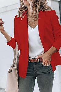 Detail of a bright red women blazer styled with casual jeans and a brown leather belt