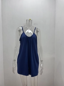 Detail of dark blue V-neck spaghetti strap romper with soft fabric and pleated bust line