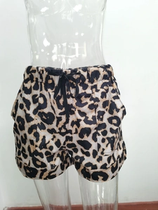 Detail view of leopard print summer shorts with drawstring elastic waist and side pockets