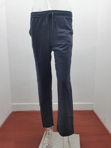 Detail of navy blue cotton linen trousers showing elastic drawstring waist and pocket