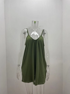 Close-up of grass green V-neck romper featuring pleated chest detail and thin straps