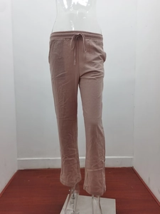 Detail of dusty pink wide leg linen trousers with drawstring elastic waist and pockets
