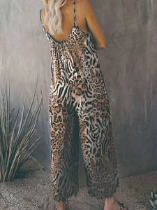 Rear view of backless leopard print jumpsuit with thin straps and wide legs