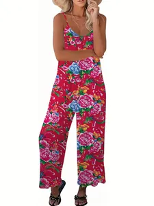 Detail of red floral wide-leg jumpsuit with peony prints and delicate spaghetti straps