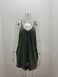 Detail of grey V-neck loose romper with thin straps and ruffled gather effect