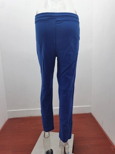 Close-up of dark blue linen pants featuring a comfortable elastic drawstring waistband
