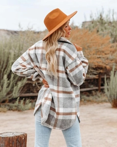 Close-up of retro plaid wool blend jacket with flannel texture and oversized fit