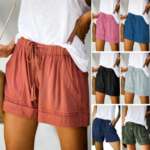 Detail of high waisted drawstring shorts showing fabric texture and 7 color options