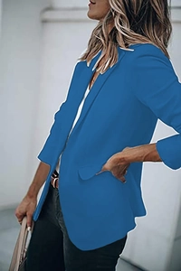 Detail view of bright blue women's casual blazer with notch lapel and single-breasted design