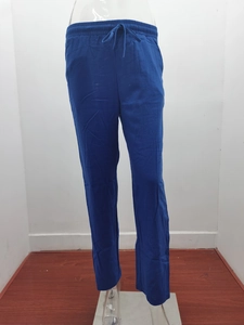 Detail view of navy cotton linen trousers featuring an elastic drawstring waistband design