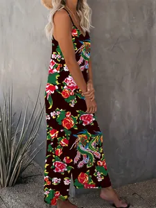Detail of floral and phoenix print on brown sleeveless maxi jumpsuit with side pockets