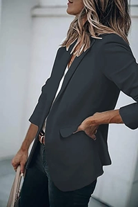 Detailed view of the sleek single-breasted black blazer jacket with elegant lapels