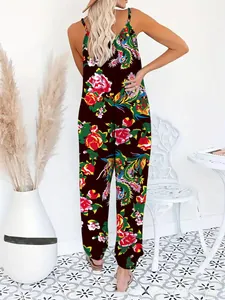 Detail view of back deep V-neckline on floral printed wide-leg jumpsuit with straps