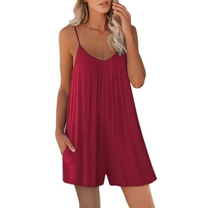 Detail view of dark red V-neck romper featuring thin straps and functional side pockets