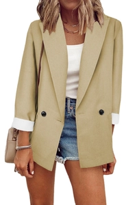 Detail of light khaki double-breasted blazer with contrast white cuffs and linen texture