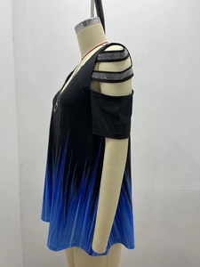 Detail of cold-shoulder sleeve with rhinestone straps and blue gradient pattern