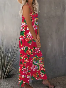 Detail of red floral V-neck jumpsuit with side slits and phoenix pattern print