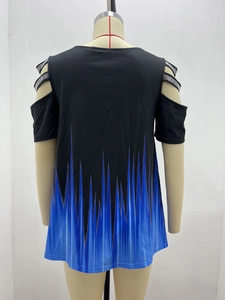 Detail showing the shoulder cut-out design with silver rhinestones on a black V-neck top
