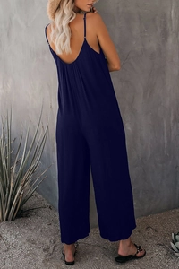 Tuta blu scuro a gamba larga con scollatura posteriore e spalline sottili per lo stile estivo