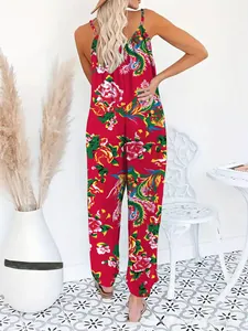 Detail of red floral bohemian jumpsuit featuring a halter neck and vibrant prints