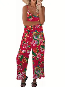Detail of vibrant red floral print wide-leg jumpsuit with V-neckline and pockets