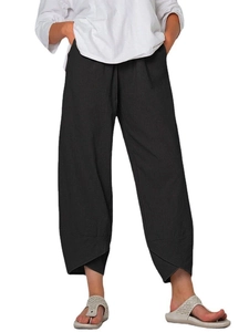 Detail view of cotton linen wide leg pants featuring unique overlapping cross cut hem design