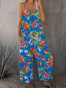 Detail of bohemian floral print and tropical phoenix pattern on loose summer jumpsuit
