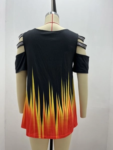 Detail of cold-shoulder sleeve with sparkling rhinestones and vibrant flame pattern