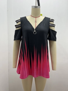 Close-up of V-neck zipper top with rhinestones and red flame gradient print pattern