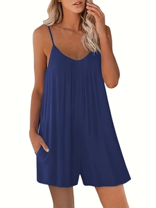 Detail of navy blue V-neck loose romper featuring thin straps and convenient side pockets