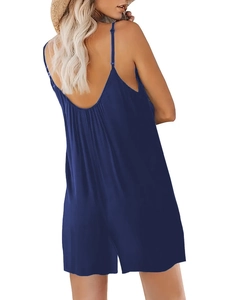 Detail showing the deep V back design and fine straps of this navy blue summer romper