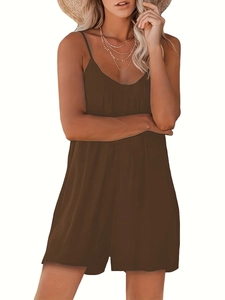 Detail of loose fit brown V-neck romper with thin straps and light textured fabric