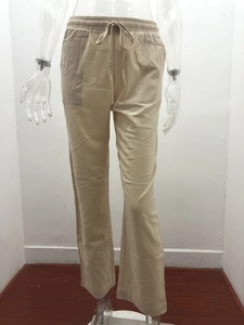 Detailed view of elastic drawstring waist on casual linen wide-leg pants in beige
