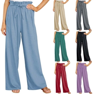 Detail view of high waist paper-bag cotton linen trousers in seven varied colors