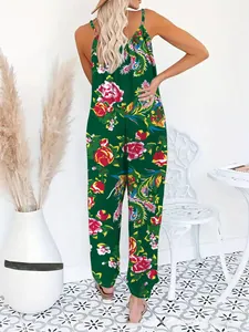 Detail of green jumpsuit back view showing spaghetti straps and floral pattern
