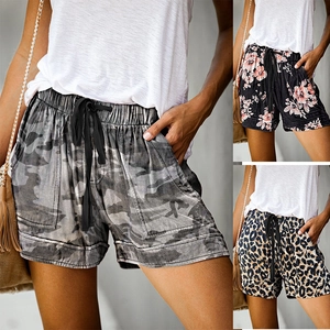Detail showing elastic drawstring waist and prints including camouflage, floral, and leopard