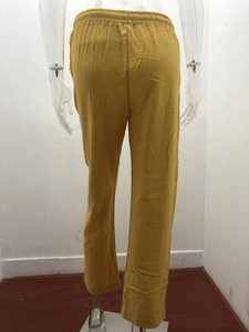 Rear view of ginger cotton linen wide leg trousers featuring a comfortable elastic waist