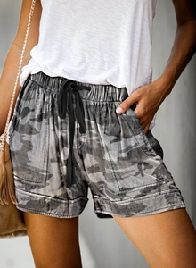 Detail of high-waist camo shorts with drawstring elastic band and side pockets